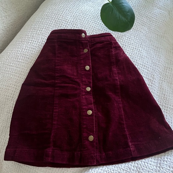 Rich, crimson red, velvet skirt, with pop buttons down the middle. - Picture 3 of 3